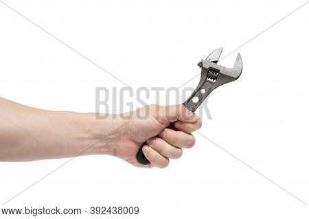 Man's Hand Holding  Wrench Isolated Over White. The Hand Holds A Wrench On White 
Background