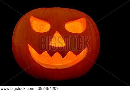 Halloween Pumpkin Isolated Against A Black Background