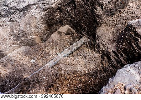 Earthworks. Shovel In The Ground In The Garden. A Bayonet Spade In The Garden. Digging Up The Soil O