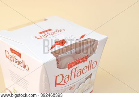 Raffaello Candies On Beige Background. Raffaello Is A Spherical Coconut Almond Confection That Itali