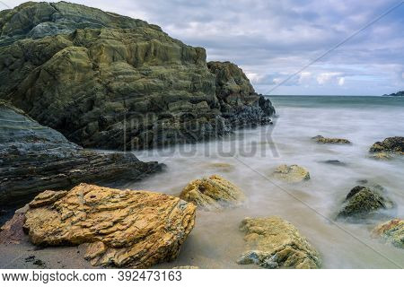 Serantes Beach Landscape With Rocks And Sea Water In Asturias, Spain