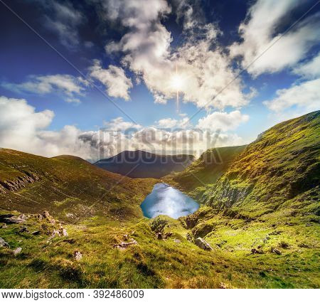 Panoramic View Of Devils Punch Bowl Lake On Mount Mangerton In The Morning. Ireland, County Kerry, K