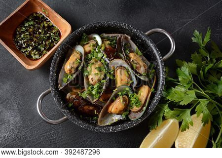 Classic French Meal Moules Marinière  Marinara Mussels With Garlic, Sauce, Lemon And Parsley.