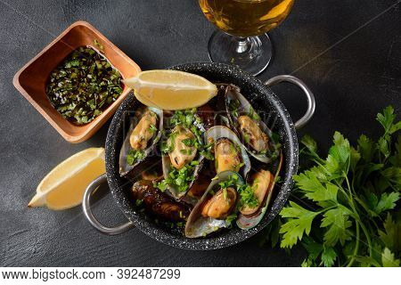 Classic French Meal Moules Marinière  Marinara Mussels With Garlic, Sauce, Lemon And Parsley.