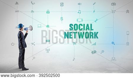 Engineer working on a new social media platform with SOCIAL NETWORK inscription concept