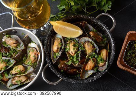 Classic French Meal Moules Marinière  Marinara Mussels With Garlic, Sauce, Lemon And Parsley.