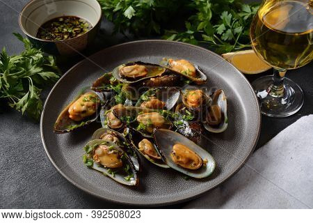 Classic French Meal Moules Marinière  Marinara Mussels With Garlic, Sauce, Lemon And Parsley.
