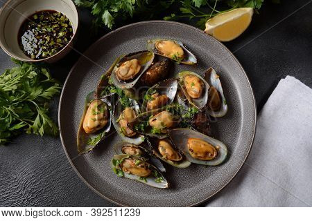 Classic French Meal Moules Marinière  Marinara Mussels With Garlic, Sauce, Lemon And Parsley.