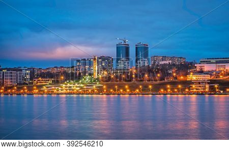 A Night Panorama Of City With Illuminated Buildings. Izhevsk Pond. Sightseeings Of Izhevsk.