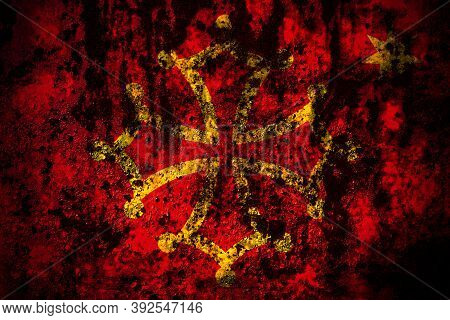 Occitania Flag On Grunge Metal Background Texture With Scratches And Cracks