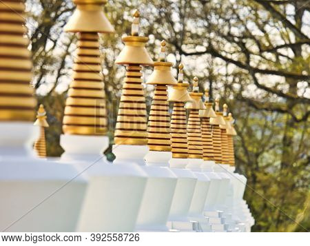 La Boulaye, France - April Circa, 2018. Several Small White Stupas With Traditional Eyes Of Buddha P
