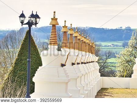 La Boulaye, France - April Circa, 2018. Several Small White Stupas With Traditional Eyes Of Buddha P