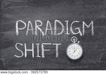 Paradigm Shift Phrase Written On Chalkboard With Vintage Precise Stopwatch