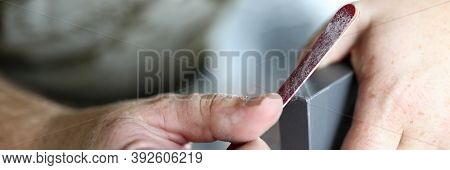 The Mans Hands Are Processing The Edges Of The Cabinet Door With A Nail File. File The Edges Of Furn
