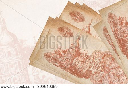 1 Ukrainian Coupon Bills Lies In Stack On Background Of Big Semi-transparent Banknote. Abstract Pres