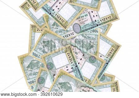 100 Nepalese Rupees Bills Flying Down Isolated On White. Many Banknotes Falling With White Copyspace