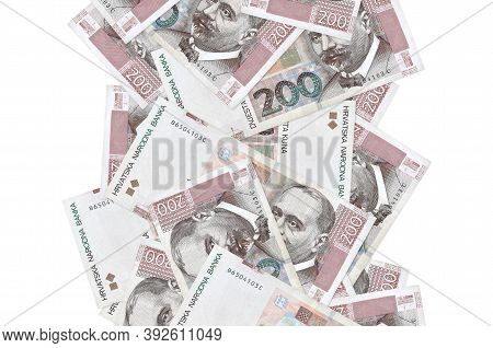 200 Croatian Kuna Bills Flying Down Isolated On White. Many Banknotes Falling With White Copyspace O