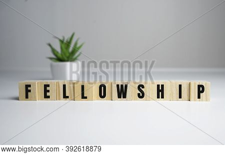 Fellowship Concept - Fellowship Word On Wooden Cubes