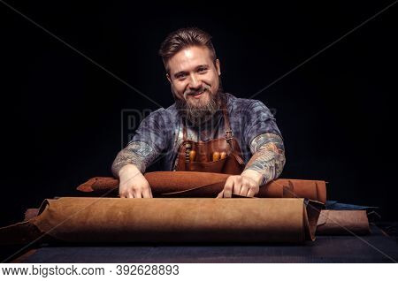 Leather Craftsman Working On A New Leather Product