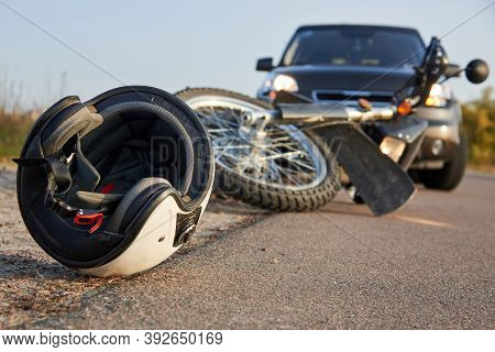 Photo Of Car, Helmet And Motorcycle On Road, The Concept Of Road Accidents.