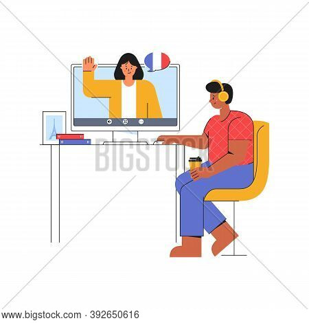 E-learning At Home. Young Man Listens To The Teacher Of French Language. Online Course On The Websit