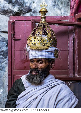 Lalibela, Ethiopia - Feb 14, 2020: Ethiopian Priest At The Famous Monastery Neakuto Leab Near Lalibe