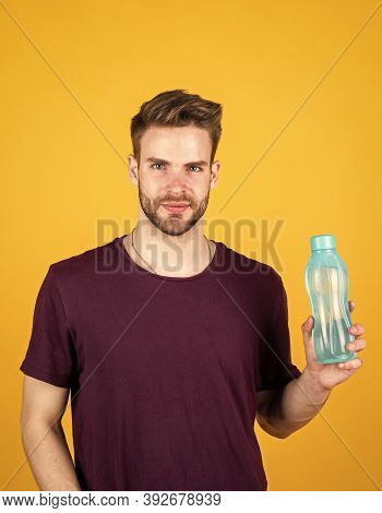 Detoxifies. Handsome Guy Hold Water Bottle. Hydration And Hydro-balance. Sport And Health. Refreshin