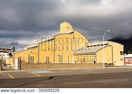 Isafjordur, Iceland - July 7, 2014: Yellow Isafjardarkirkja Church With Unusual Architecture Design 
