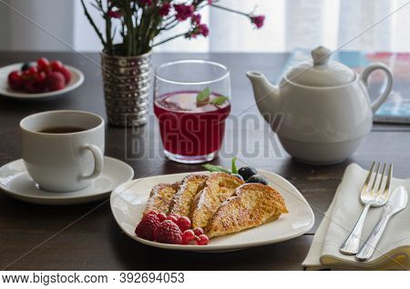 Spanish Torrijas Or French Toasts With Berries And Icing Sugar For Breakfast In Hotel Restaurant.