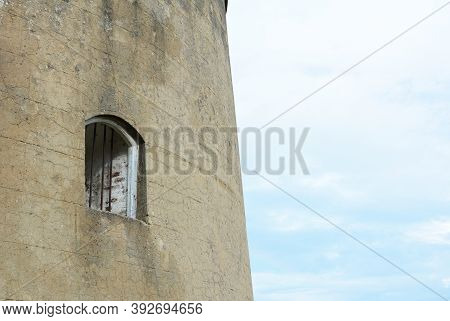 Window With Metal Bars Set Into The Thick Wall Of The Martello Tower Known As Wish Tower In The Coas