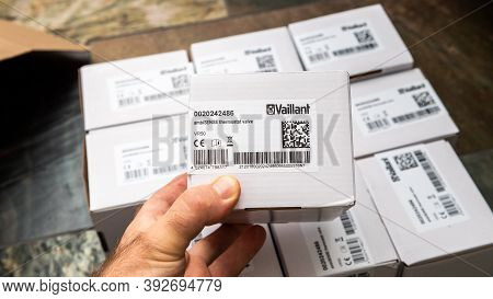 Paris, France - Oct 25, 2020: Pov Male Hand Showing Package Above Multiple Vaillant Ambisense Vr50 T