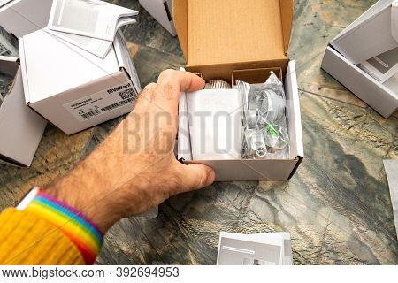 Paris, France - Oct 25, 2020: Man Hand Unboxing Package Of Vaillant Ambisense Vr50 Thermostatic Valv