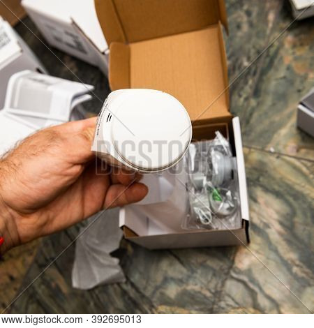 Paris, France - Oct 25, 2020: Man Hand Unboxing Package Of Vaillant Ambisense Vr50 Thermostatic Valv