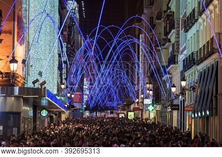 Madrid, Spain - January 4, 2020: Crowds Of People Gather At The Calle Preciados In Madrid Under The 