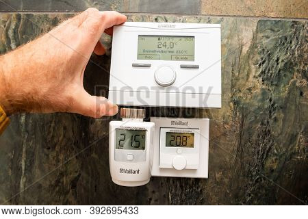 Paris, France - Oct 25, 2020: Pov Man Showing Vaillant Iot Devices - Vrc 700f Weather Compensating T