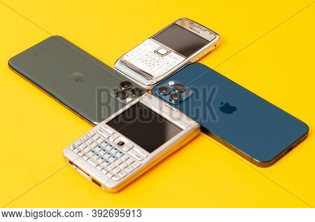 Paris, France - Oct 23, 2020: Vintage Nokia E61, E71, 11 Pro Next To New Iphone 12 Pro Max 5g Smartp