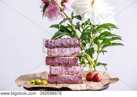 Pink Pieces Of Mousse Raw Cake Are Arranged In The Form Of A Pramida One On Top Of The Other. Next T