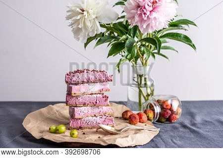 Pink Pieces Of Mousse Raw Cake Are Arranged In The Form Of A Pramida One On Top Of The Other. Next T