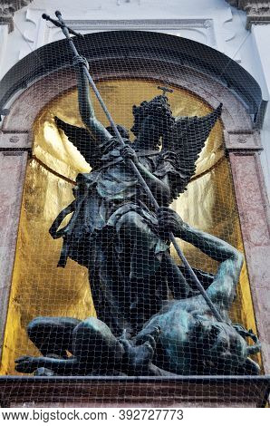 Angel Statue Of St. Michael Kirche Church In Neuhauser Strasse For German People And Foreign Travele