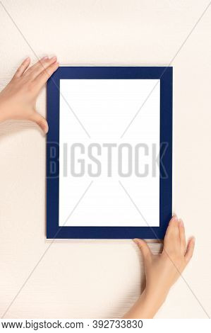 Mockup Diploma. Woman Hanging Photo Frame Mockup On Wall. Certificate, Diploma, Picture, Gratitude W