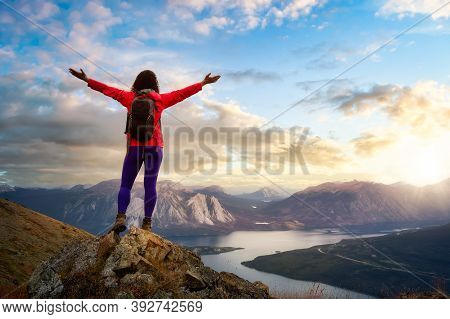 Adventurous Girl Hiking Up The Nares Mountain. Dramatic Colorful Sunrise Sky Art Render. Taken Near 