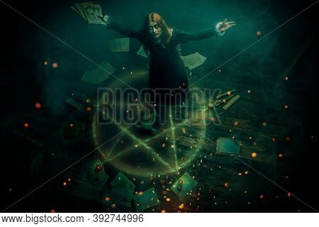 A portrait of a scary witch in the wooden house in green smoke. Magic, dark force, spell. 