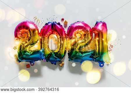 Rainbow Colored Foil Balloons In The Form Of Numbers 2021. New Year Celebration