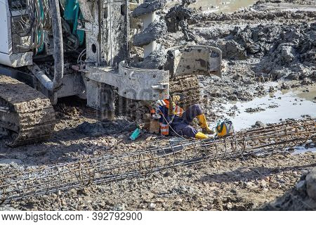 Repair Welding On Indsutrial Machinery At Construction Site. Field Welding Repair, Manual Arc Weldin