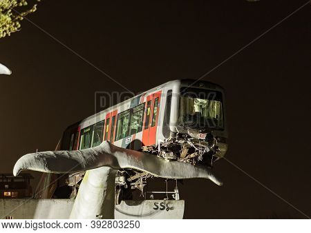 Spijkenisse, The Netherlands - November 2, 2020: Whale Tail Sculpture Stops Rotterdam Metro Train Fr