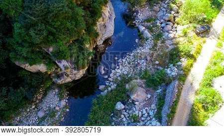 Aerial View Of Small River Running In The Forest Next To Mountain, Located In Miyun, Natural Reserve