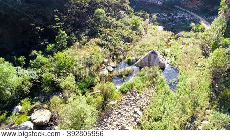 Aerial View Of Small River Running In The Forest Next To Mountain, Located In Miyun, Natural Reserve