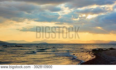Seascape with the sea and islands at sundown. Aegina island, Greece. Greek lanscape