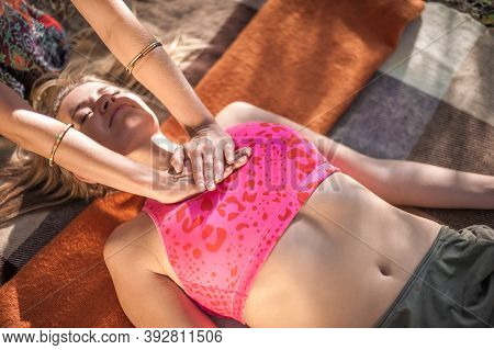 Proffesional Masseuse Demonstrates Refreshing Massaging Methods Out In The Forest.