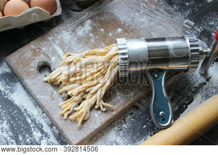 Machine For Cooking Pasta. The Dough For Pasta.metal Machine For Production Of Pasta And Ingredients